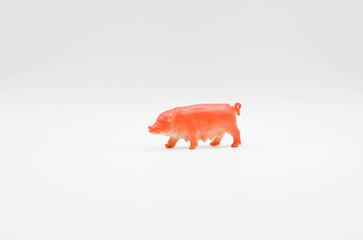 pig.plastic toy on a white background