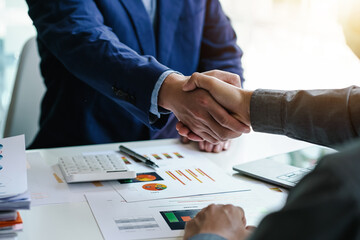 Business people handshake after meeting, executives to congratulate the joint business agreement.