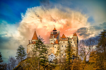 Stunning sunset over Bran Castle, Transylvania, Romania. A medieval landmark building known as Castle of Dracula.