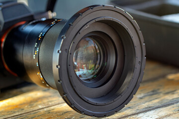 Camera lens adjusting aperture and zoom in and out