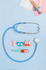 Medicine flat lay concept blue background