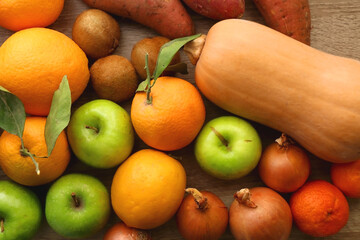 Various healthy fruit and vegetable on wooden background. Top view.
