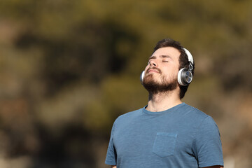 Man breathing meditating listening audio guide