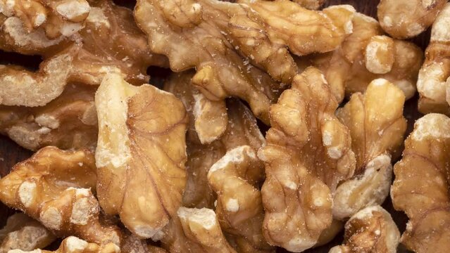 Closeup top view of walnuts. Food backdrop