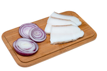 Lard with onion arranged on a board isolated on white background