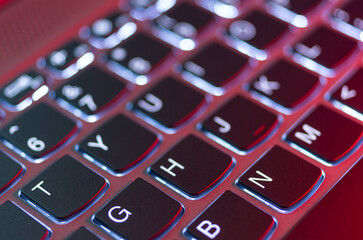 Laptop keyboard illuminated by a nice red light