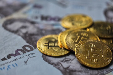 Ukrainian money with Cryptocurrency Coins.Bitcoin BTC, Ukrainian hryvnia, Tether USDT cryptocurrency physical coin