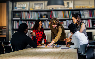 Group of diverse and multiracial businesspeople wearing casual clothes for work, meeting and brainstorming about project and marketing plan in modern indoor meeting room at office. Business Concept.