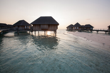 Water Bungalows in Turquoise Sea at Maldives