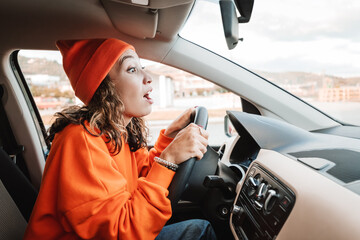 A novice girl parks a car during an exam or a driving lesson. A small accident and a bumper scratch...