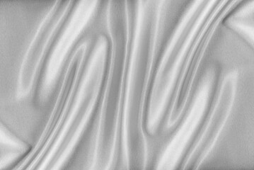 Fototapeta na wymiar Closeup of rippled white silk fabric. White silk fabric as an abstract background.