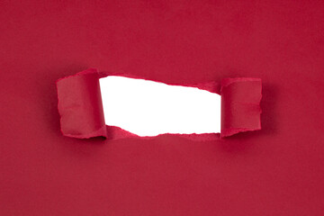 Red marsala paper damaged torn with white hole isolated copyspace for text © Liza