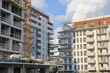 block construction, cement construction, construction crane, residential construction, construction site, apartment blocks with large balconies, housing estate