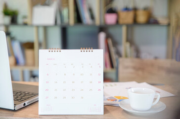Appointment Calendar Concept. Desktop Calender, Diary, Coffee place on business office desk, work at home. Notebook for Planner plan timetable, agenda, appointment management each date, month, year