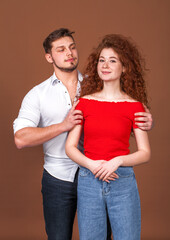 Beautiful red hair girl posing with her boyfriend