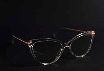 glasses on black background