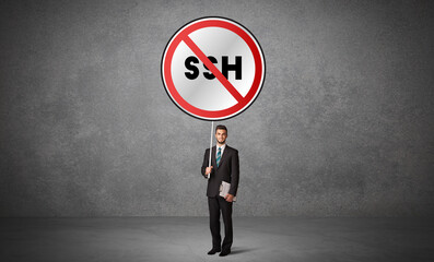 Young business person holdig traffic sign