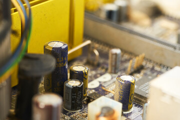 Old computer system unit with spiderweb and dust inside.