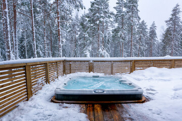 The warm hot tub invites you to relax in the beautiful winter landscape as the snow slowly falls...