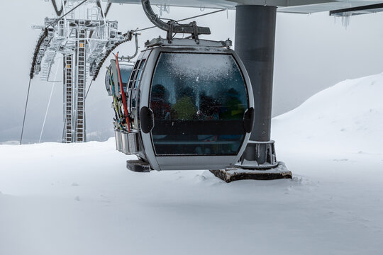 Gondola lifts on top of the mountain in winter