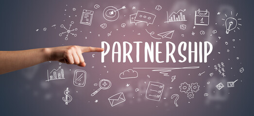 Close-Up of cropped hand pointing at business inscription