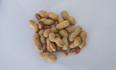 Peanuts on white background - shelled peanuts