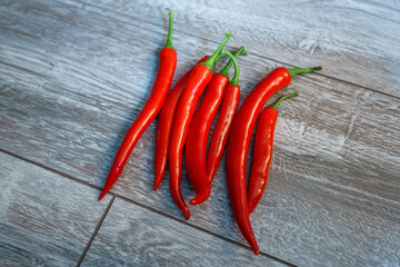  red hot chilli pepper on wooden table