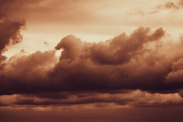 Storm sky with dark grey cumulus clouds.  Thunderstorm