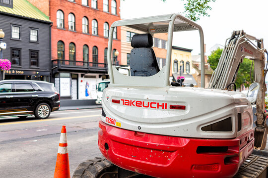Washington DC, USA - August 18, 2021: M street historic street in Georgetown with traffic in road and Takeuchi truck construction