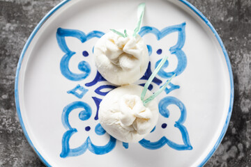 Italian burrata cheese made from mozzarella with cream inside from Apulia region