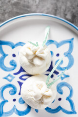 Italian burrata cheese made from mozzarella with cream inside from Apulia region