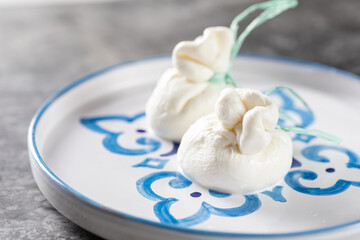 Italian burrata cheese made from mozzarella with cream inside from Apulia region