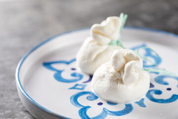 Italian burrata cheese made from mozzarella with cream inside from Apulia region