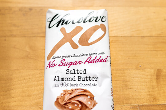 Herndon, USA - October 8, 2021: Sign label for Chocolove XO brand no sugar added salted almond butter dark chocolate with bar packaging on table