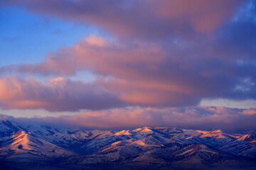Sunrise or Sunset Sunlight on Snowy Mountains Pink Light