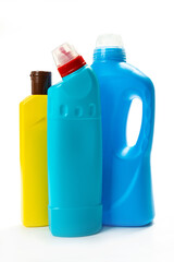  multicolored plastic bottles with household for chemicals on a white background