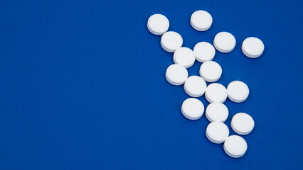 Medcine white pills aspirin pharmacy on blue background