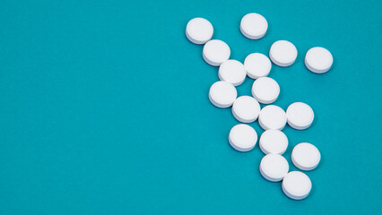 Medcine white pills aspirin pharmacy on blue background