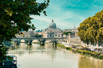 Fototapeta premium One of the many bridges in Rome over the river Tiber with St Marks Basilica in the distance