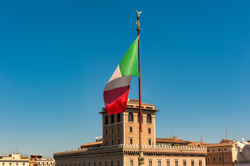 The Italian Flag, often known as the Tricolore, flying in the Piazza Venezia (Venice Square) in Rome, Italy