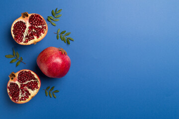 Fresh juicy pomegranate on color background, top view