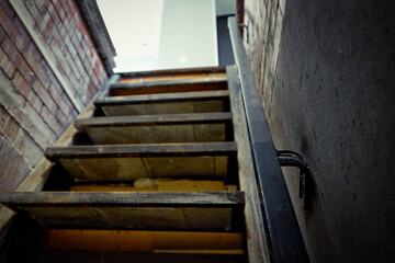 Exit from the brick cellar with a railing up the stairs to the light. Exit from the storage room,...