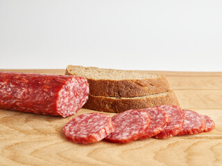 Making sandwiches from bread and sausage.