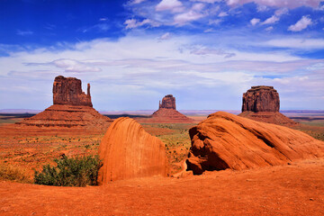Famous Arizona desert view over Monument Valley, USA. Red rocks under blue sky.