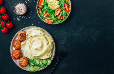 Turkey patties served with mashed potato and fresh salad