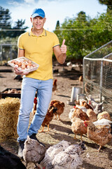 male farmer on chicken farm © JENOCHE