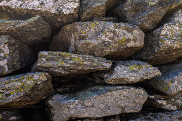 texture of the stone rocks of a dry stone wall