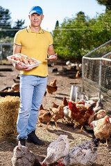 male farmer oon chicken organic farm © JENOCHE