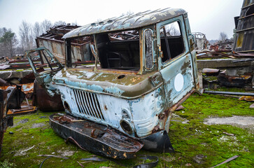 Abandoned cab of an old rotten rusty soviet truck. Recycling scrap