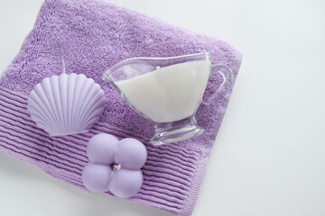 spa theme. handmade massage candles made of natural soy wax, a set of towels in pastel colors
